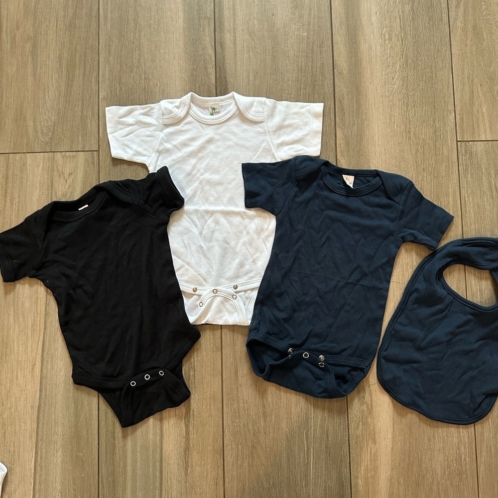 Bulk onesies and matching bib. Laughing giraffe and rabbit skins